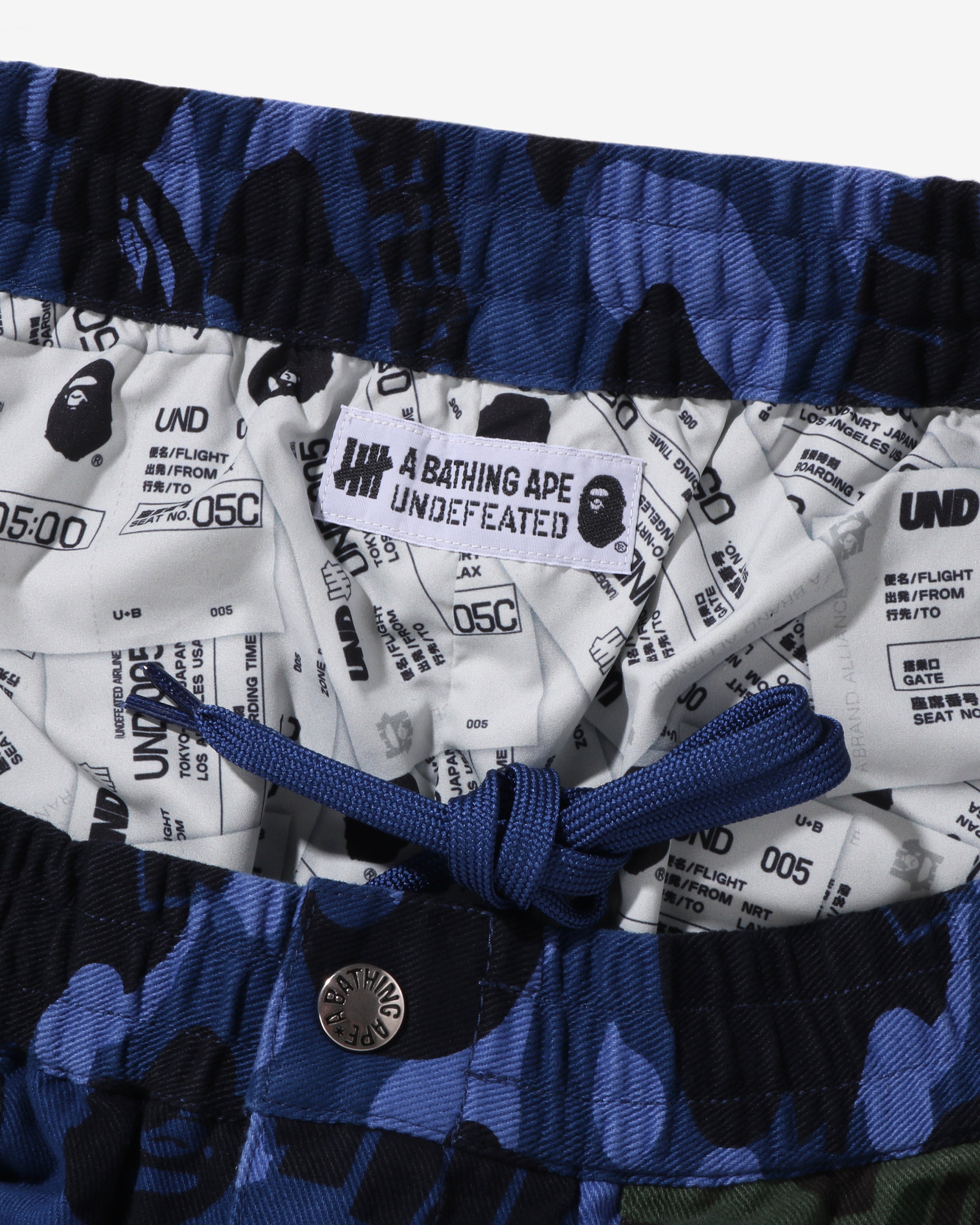 BAPE X UNDEFEATED COLOR CAMO FLANNEL PANTS