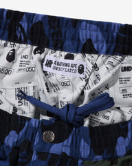 BAPE X UNDEFEATED COLOR CAMO FLANNEL PANTS